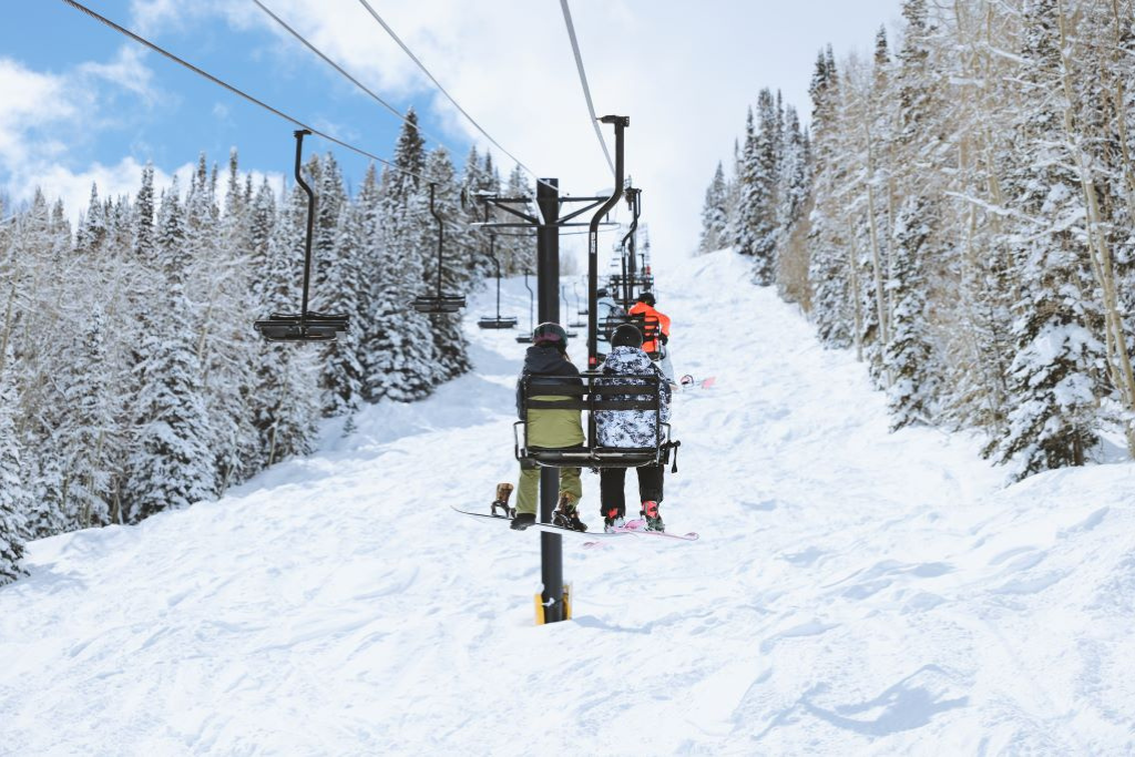 Skier and Boarder on Primo Lift at Sunlight Mountain Resort