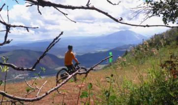 Mountain Biker looking at Sopris on Grandstaff Trail