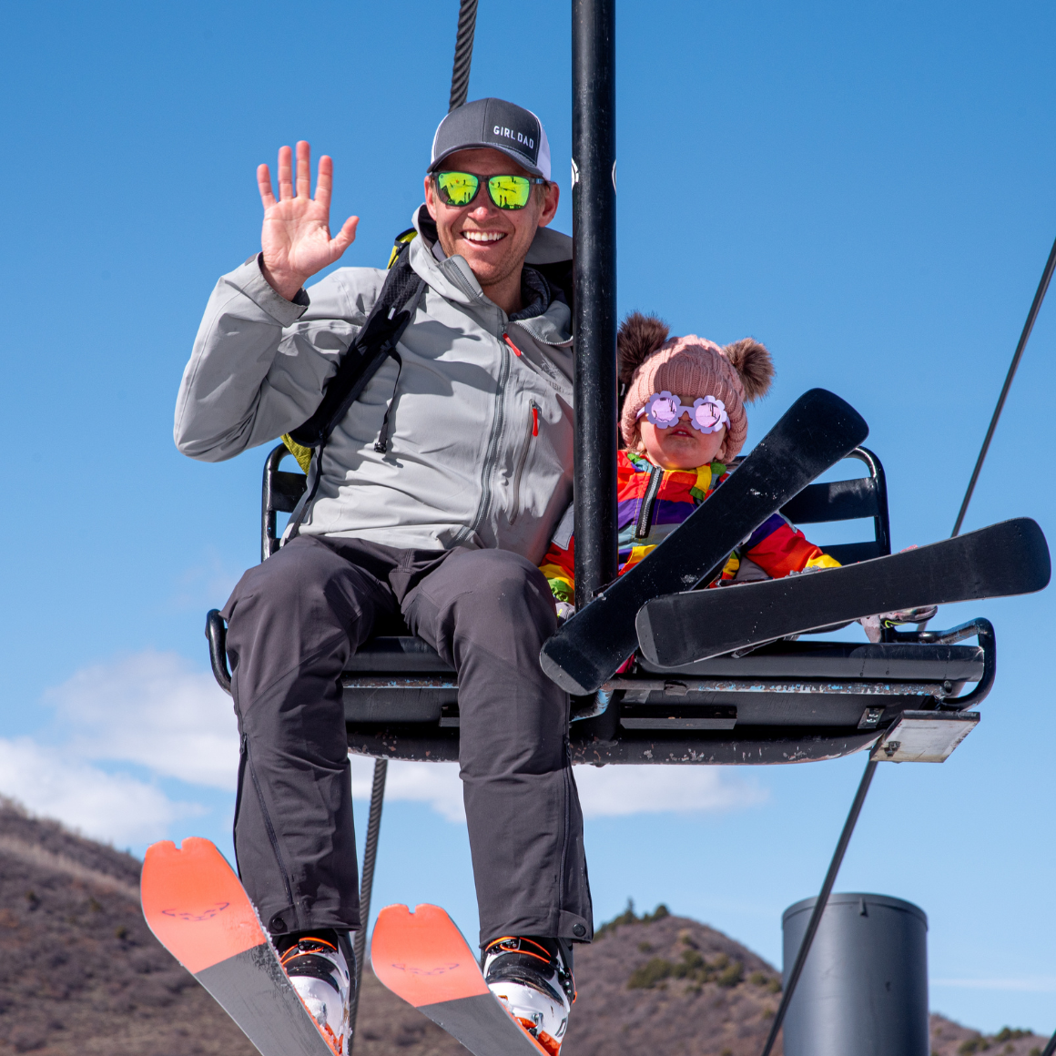 family on ski lift while visiting sunlight mountain in glenwood springs