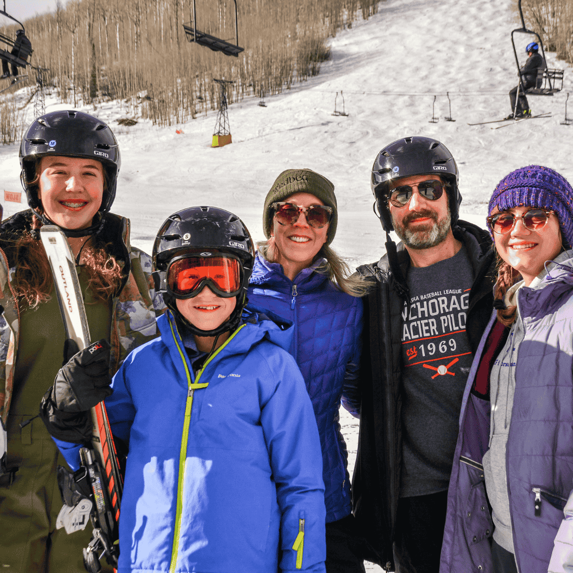 family poses at sunlight mountain while skiing