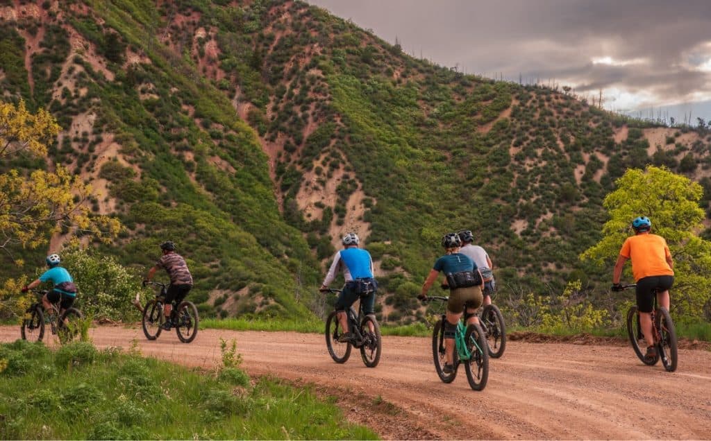 A group of bikers on a dirt road